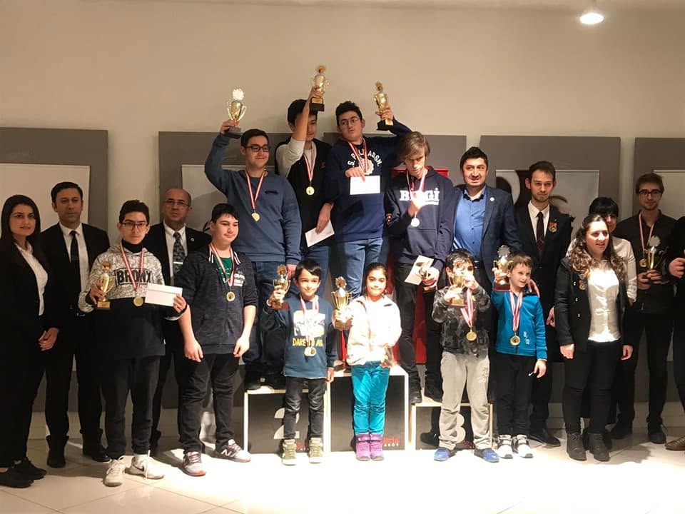 Young chess players and organizers gathered at an awards ceremony